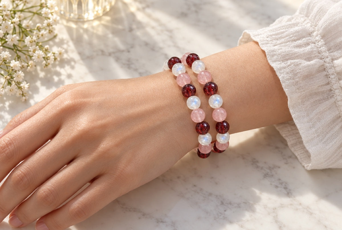 Two Charmi bracelets stacked on the left wrist